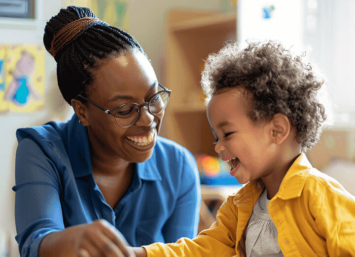 Therapist and child enjoying a learning activity in ABA therapy session